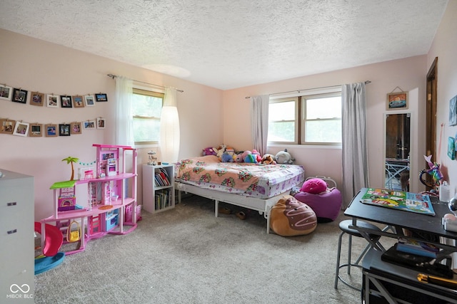 955 Wood Creek Pl, Greenwood, IN 46142 - bedroom featuring multiple windows, carpet floors, and a textured ceiling