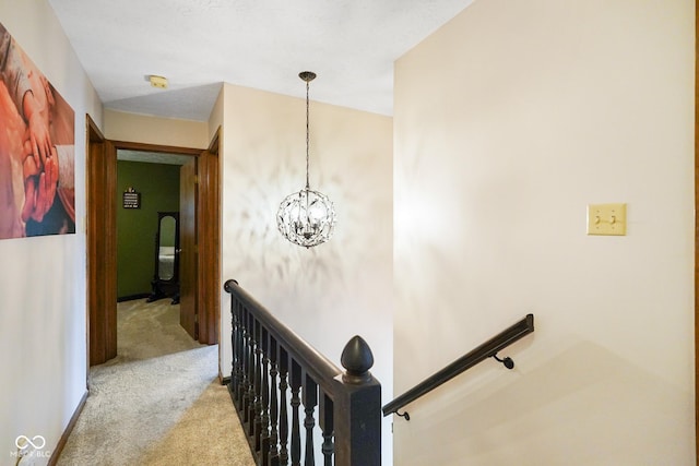 955 Wood Creek Pl, Greenwood, IN 46142 - stairway with carpet flooring and a chandelier