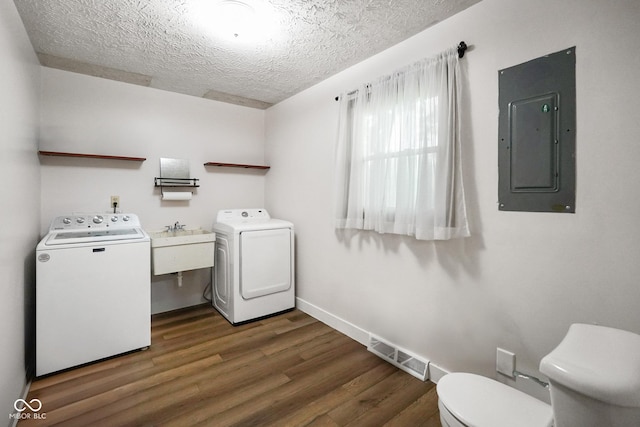 955 Wood Creek Pl, Greenwood, IN 46142 - laundry room with washer / clothes dryer, a textured ceiling, electric panel, and dark wood-type flooring