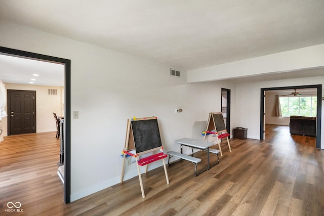 955 Wood Creek Pl, Greenwood, IN 46142 - sitting room featuring wood finished floors and baseboards
