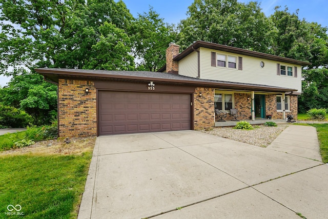 955 Wood Creek Pl, Greenwood, IN 46142 - traditional-style home with brick siding, a garage, covered porch, a chimney, and concrete driveway