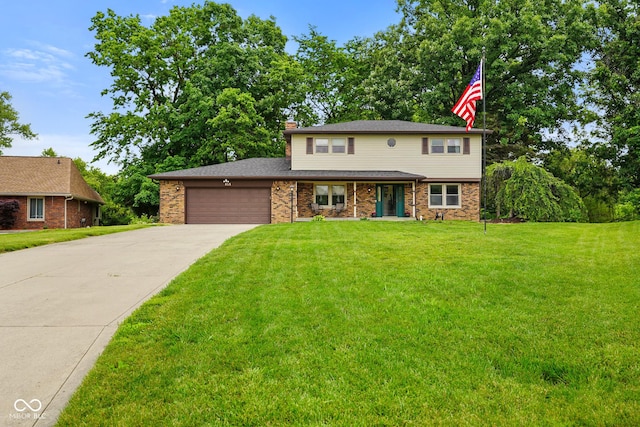 955 Wood Creek Pl, Greenwood, IN 46142 - view of front of house featuring an attached garage, driveway, a front lawn, brick siding, and a chimney