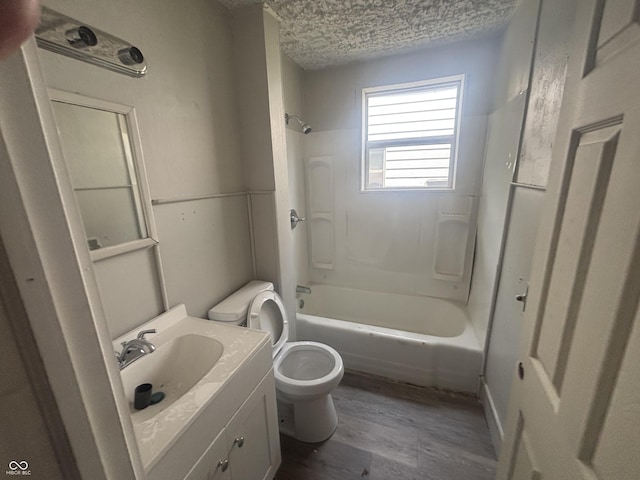 2826 Station St, Indianapolis, IN 46218 - full bathroom featuring toilet, vanity, bathing tub / shower combination, and wood finished floors