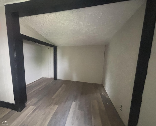 2826 Station St, Indianapolis, IN 46218 - spare room with wood finished floors and a textured ceiling