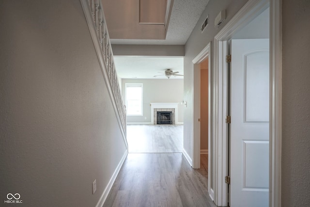 12382 Cool Winds Way, Fishers, IN 46037 - hall with wood finished floors, baseboards, and a textured wall