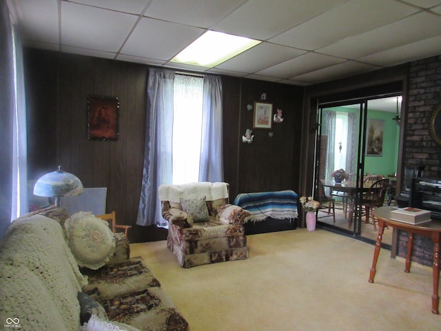 112 Orchard St, Waynetown, IN 47990 - carpeted living room featuring a drop ceiling and wooden walls
