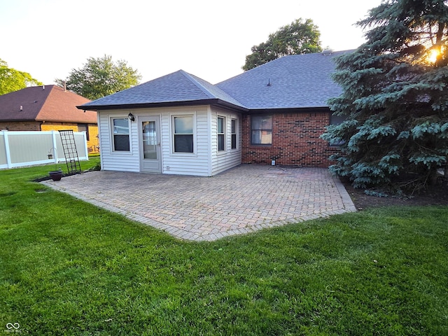 1201 Briarwood Dr, Brownsburg, IN 46112 - rear view of house with a shingled roof, a patio area, and brick siding