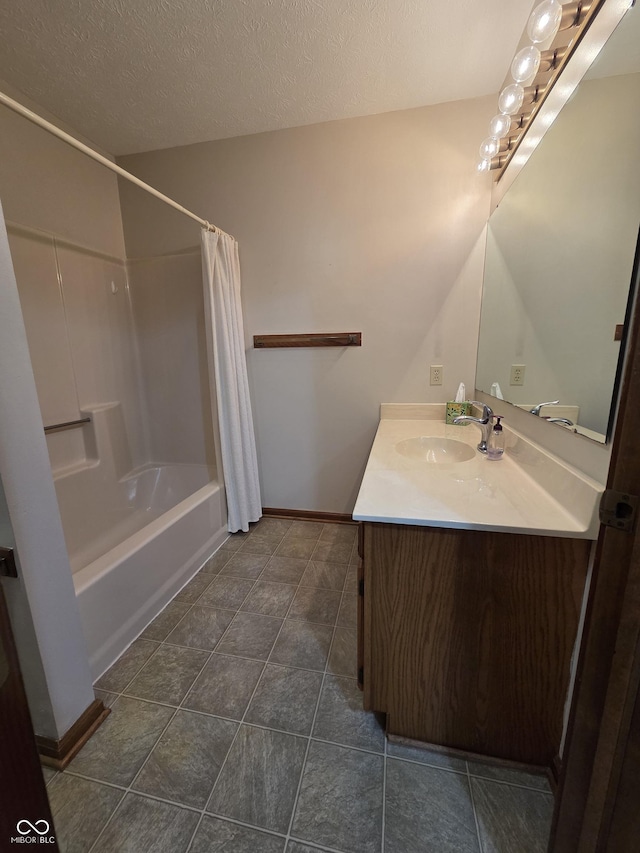1201 Briarwood Dr, Brownsburg, IN 46112 - full bathroom featuring vanity, shower / bath combo, a textured ceiling, baseboards, and tile patterned floors