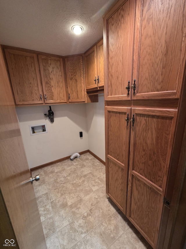 1201 Briarwood Dr, Brownsburg, IN 46112 - laundry room with cabinet space, baseboards, hookup for a washing machine, and a textured ceiling