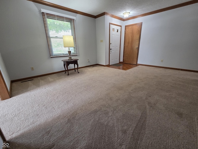 1201 Briarwood Dr, Brownsburg, IN 46112 - spare room featuring ornamental molding, carpet, and baseboards