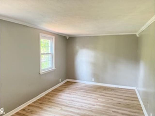 3100 Oak St, Terre Haute, IN 47803 - spare room featuring wood finished floors, baseboards, and ornamental molding