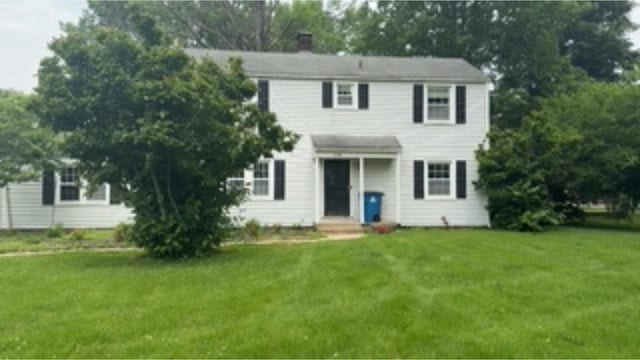 3100 Oak St, Terre Haute, IN 47803 - view of front of house featuring a front lawn, a chimney, and entry steps