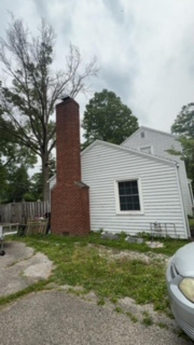 3100 Oak St, Terre Haute, IN 47803 - view of side of home featuring a chimney