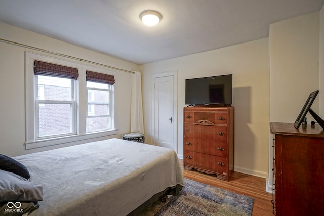 5435 E 10th St, Indianapolis, IN 46219 - bedroom with wood finished floors and baseboards