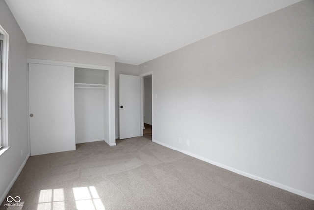 3148 Arbutus Dr, Indianapolis, IN 46224 - unfurnished bedroom with carpet floors, a closet, and baseboards