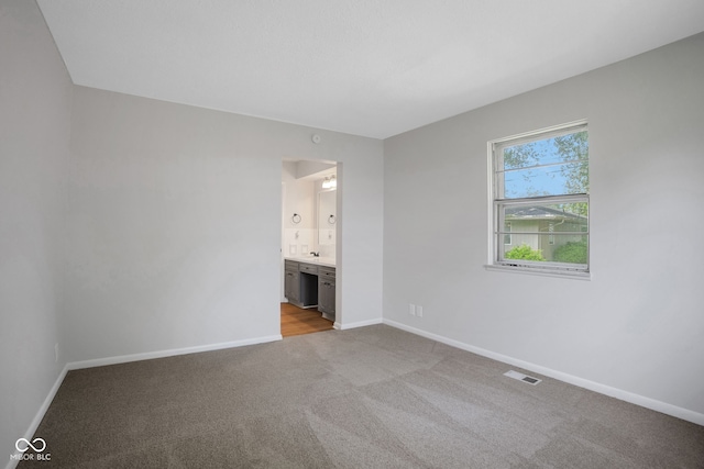 3148 Arbutus Dr, Indianapolis, IN 46224 - spare room featuring light carpet and baseboards