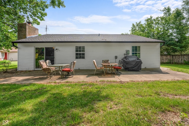5811 Simmul Cir, Indianapolis, IN 46221 - rear view of property with a patio, a chimney, and a shingled roof