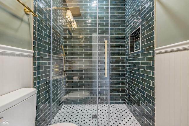 2831 N Talbott St, Indianapolis, IN 46205 - bathroom featuring toilet, a wainscoted wall, a shower stall, and a decorative wall