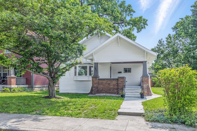 2831 N Talbott St, Indianapolis, IN 46205 - craftsman-style house featuring a front yard and covered porch