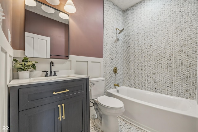 2831 N Talbott St, Indianapolis, IN 46205 - bathroom featuring toilet, vanity,  shower combination, and wainscoting