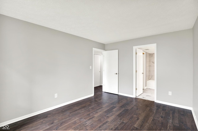 8545 La Corrida Ct, Indianapolis, IN 46227 - unfurnished bedroom with wood finished floors, baseboards, and ensuite bathroom