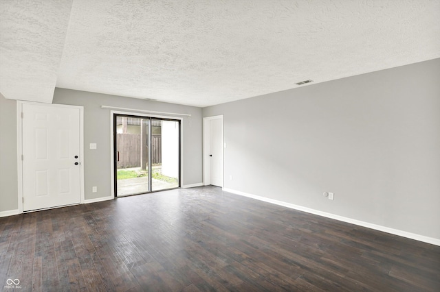 8545 La Corrida Ct, Indianapolis, IN 46227 - empty room featuring baseboards, dark wood-style floors, and a textured ceiling