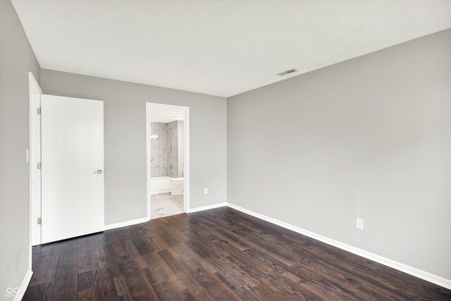 8545 La Corrida Ct, Indianapolis, IN 46227 - unfurnished bedroom featuring wood finished floors, baseboards, and ensuite bathroom