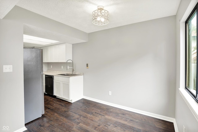 8545 La Corrida Ct, Indianapolis, IN 46227 - kitchen featuring a sink, dishwasher, freestanding refrigerator, dark wood finished floors, and light countertops