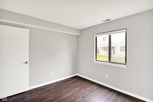 8545 La Corrida Ct, Indianapolis, IN 46227 - spare room with dark wood-type flooring, baseboards, and a textured ceiling