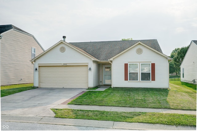 8148 Gathering Cir, Indianapolis, IN 46259 - view of front facade with an attached garage, a front yard, driveway, and roof with shingles