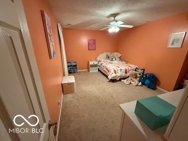 1711 Jaques Dr, Lebanon, IN 46052 - unfurnished bedroom featuring carpet flooring, a ceiling fan, baseboards, and a textured ceiling