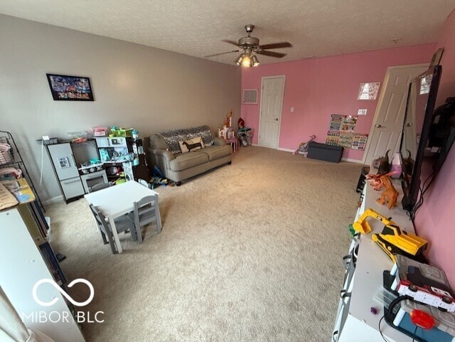 1711 Jaques Dr, Lebanon, IN 46052 - living area featuring carpet floors, ceiling fan, and a textured ceiling