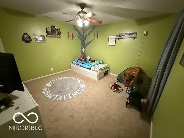 1711 Jaques Dr, Lebanon, IN 46052 - carpeted bedroom featuring baseboards and a ceiling fan