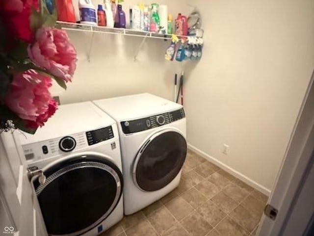 1711 Jaques Dr, Lebanon, IN 46052 - laundry area featuring washer and dryer and baseboards
