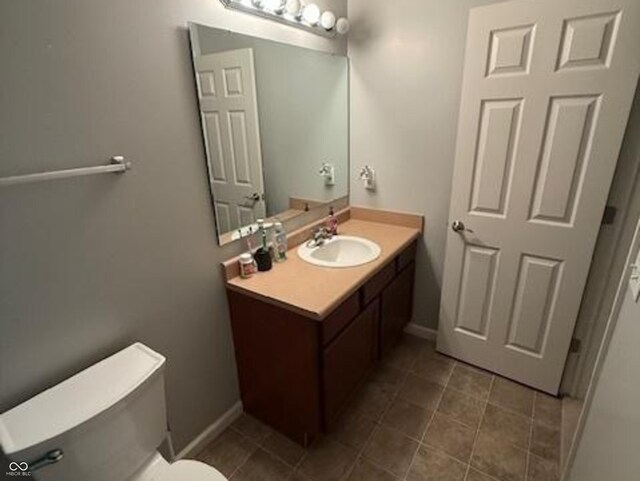 1711 Jaques Dr, Lebanon, IN 46052 - bathroom featuring vanity, toilet, baseboards, and tile patterned flooring