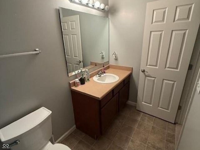 1711 Jaques Dr, Lebanon, IN 46052 - bathroom featuring vanity, toilet, baseboards, and tile patterned flooring