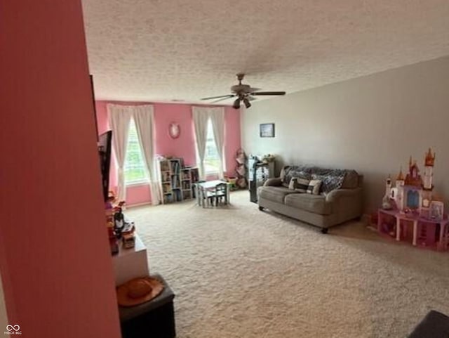 1711 Jaques Dr, Lebanon, IN 46052 - living room featuring a ceiling fan, carpet flooring, and a textured ceiling
