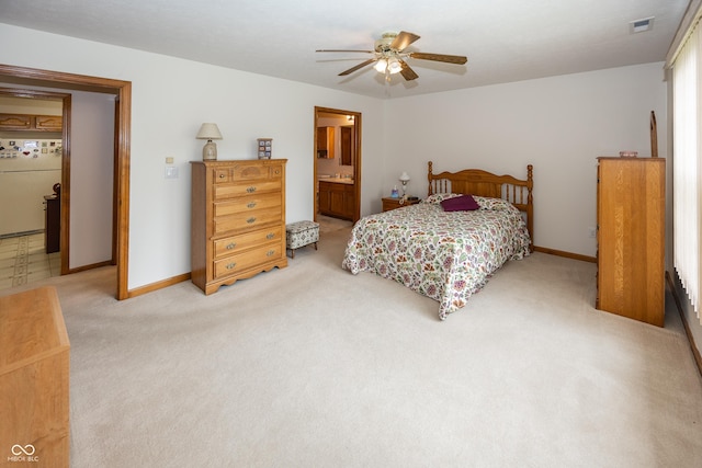 7632 Sea Crest Way N, Noblesville, IN 46062 - bedroom featuring freestanding refrigerator, light colored carpet, baseboards, ceiling fan, and ensuite bath