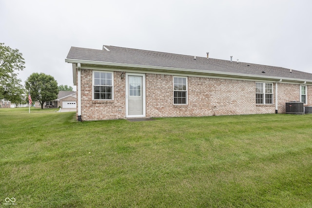 7632 Sea Crest Way N, Noblesville, IN 46062 - rear view of property with central AC, a yard, brick siding, and roof with shingles