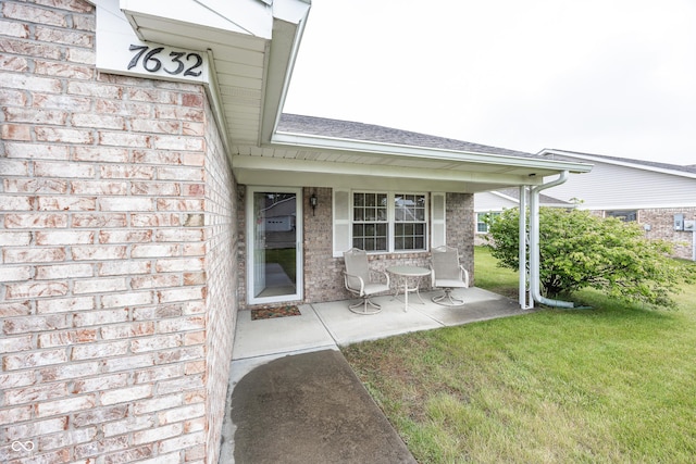 7632 Sea Crest Way N, Noblesville, IN 46062 - doorway to property with brick siding, a yard, and a shingled roof