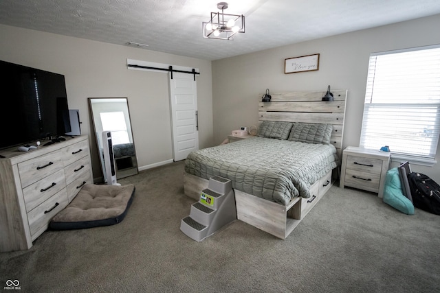 1981 Turning Leaf Dr, Franklin, IN 46131 - bedroom featuring a barn door and carpet flooring