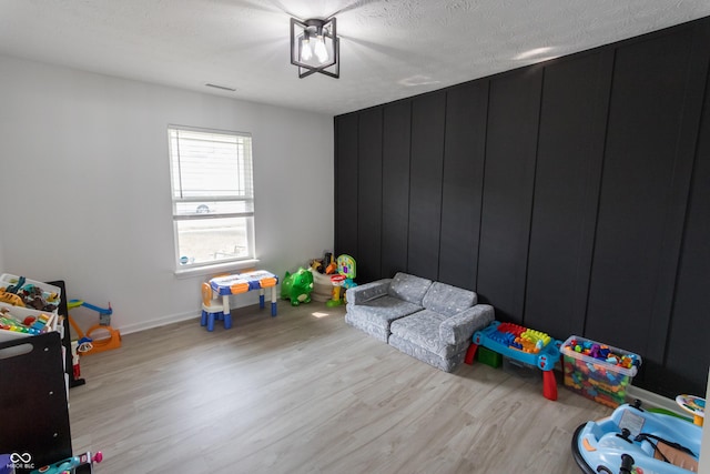 1981 Turning Leaf Dr, Franklin, IN 46131 - playroom featuring light wood-style flooring and baseboards