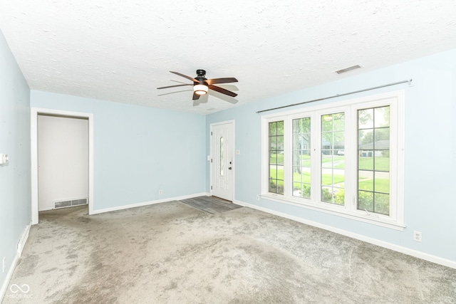 713 W Cromer Ave, Muncie, IN 47303 - entryway featuring carpet, a textured ceiling, and ceiling fan