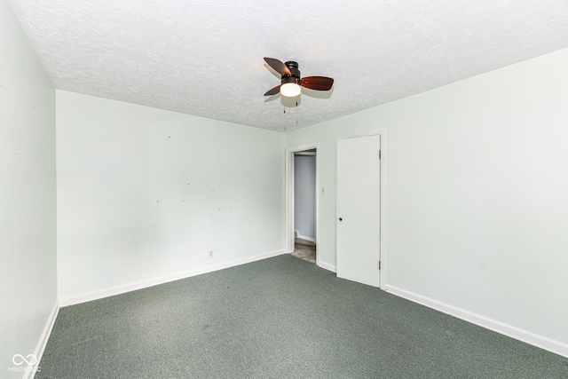 713 W Cromer Ave, Muncie, IN 47303 - spare room with ceiling fan, dark colored carpet, and a textured ceiling