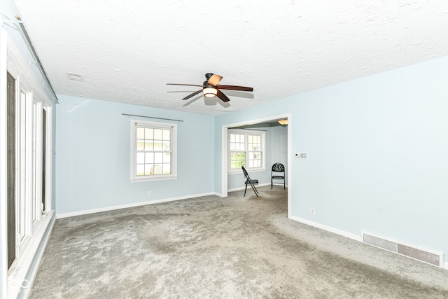 713 W Cromer Ave, Muncie, IN 47303 - carpeted spare room featuring a ceiling fan and a textured ceiling