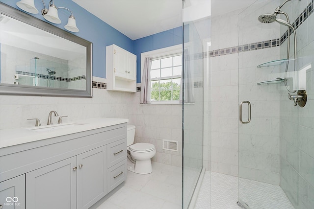 6146 Rucker Rd, Indianapolis, IN 46220 - full bath featuring tile walls, a stall shower, and vanity