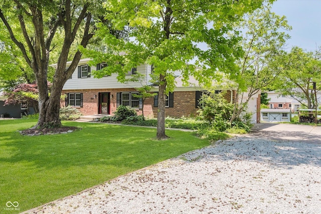6146 Rucker Rd, Indianapolis, IN 46220 - view of front of home with brick siding, concrete driveway, and a front yard
