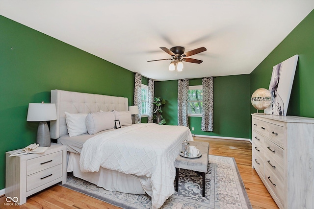 6146 Rucker Rd, Indianapolis, IN 46220 - bedroom with light wood finished floors and ceiling fan