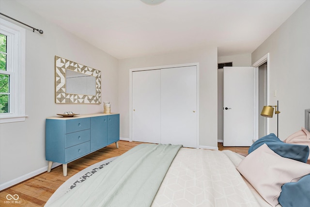 6146 Rucker Rd, Indianapolis, IN 46220 - bedroom featuring light wood-style floors and a closet