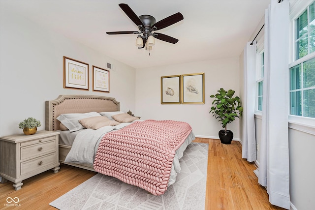 6146 Rucker Rd, Indianapolis, IN 46220 - bedroom featuring light wood-style flooring and a ceiling fan